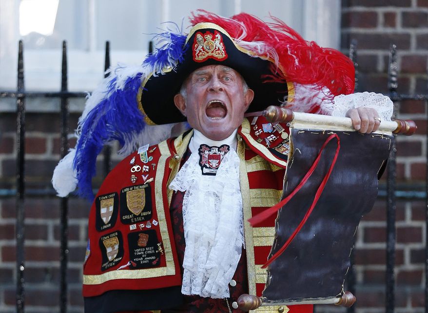FILE - In this July 22, 2013 file photo,Tony Appleton, a town crier, announces the birth of the royal baby, outside St. Mary's Hospital exclusive Lindo Wing in London, Palace officials say Prince William's wife Kate has given birth to a baby boy. Riffing off prior Monegasque ritual, Prince Albert II set the ground rules for how Monaco announced the births of little Gabriela and Jacques to Princess Charlene on Wednesday. (AP Photo/Lefteris Pitarakis, File)