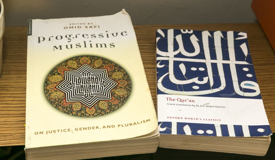 The Quran (right) is the Muslim holy book. (AP Photo/Damian Dovarganes)