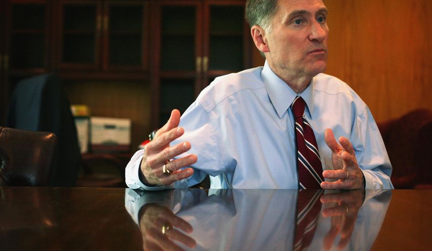 FILE - In this May 1, 2014 file photo, Southern Illinois University President Randy Dunn, addresses his goals at his office in Carbondale, Ill. In a departure from previous methods of nominating school officials, Southern Illinois University will not use an outside search firm to hire a new chancellor, according to President Dunn. Instead, an internal committee will be formed to conduct a search, saving the school as much as $120,000, he said. (AP Photo/The Southern Illinoisan, Steve Matzker, File)