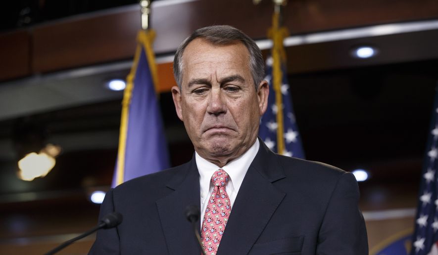 House Speaker John Boehner of Ohio pauses while holding what may be his last news conference of the 113th Congress, though critical legislation is still pending, Thursday, Dec. 11, 2014, on Capitol Hill in Washington. (AP Photo/J. Scott Applewhite)