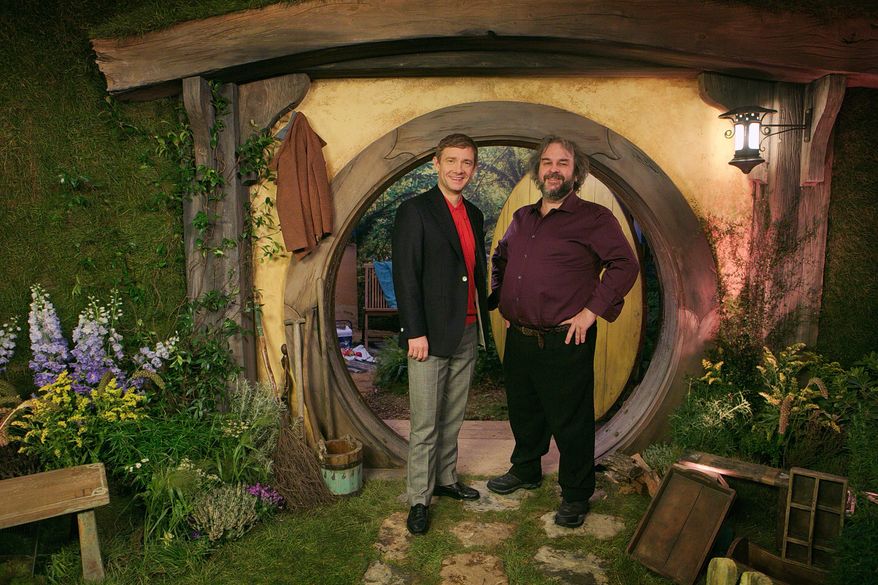 In this picture taken on Monday, Dec. 1, 2014. British actor Martin Freeman and director Peter Jackson from New Zealand poses for photographs in promotion for the film 'The Hobbit, Battle of the Five Armies' in the Claridges suite in west London. After a long and eventful journey, "The Hobbit" trilogy has reached its bloody climax. Not a minute too soon for director Peter Jackson, who has been longing to unleash mayhem on Middle Earth. "It's the first time we've got to kill dwarves," said the director, his enthusiasm for death and destruction at odds with his laid-back manner and luxurious surroundings in a London hotel suite. "It's hard to get any emotional power in a film unless you are able to actually kill some of your main characters,” he said. “We've been hampered with that in the first two 'Hobbit' movies. But at least we have a good dwarf death toll in the third one." "The Hobbit: The Battle of the Five Armies" wraps up the trilogy spun from J.R.R. Tolkien's slim book about home-loving hobbit Bilbo Baggins, coaxed away from his burrow to help a band of dwarves retake their mountain home from a destructive dragon.(Photo by Joel Ryan/Invision/AP)