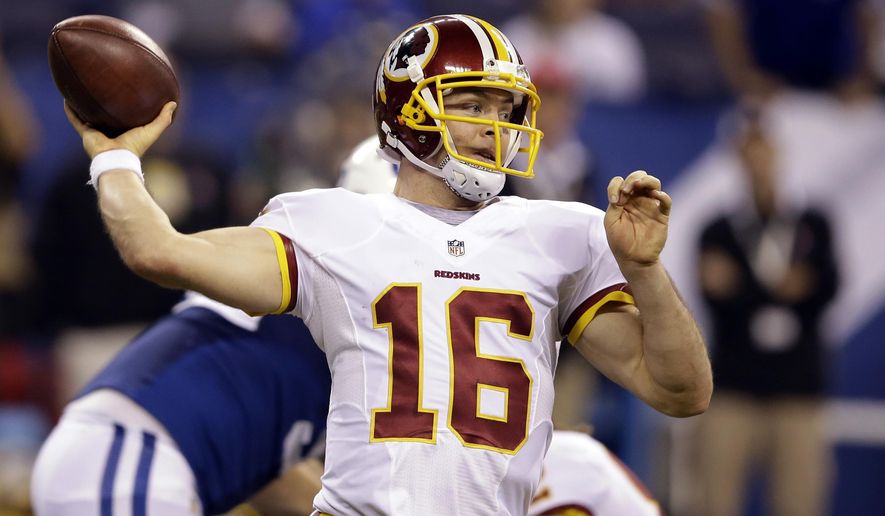 FILE - In this Nov. 30, 2014, file photo, Washington Redskins quarterback Colt McCoy throws a pass against the Indianapolis Colts during the second half of an NFL football game in Indianapolis. McCoy took part in the full Redskins practice Friday, Dec. 12, 2014, getting all of the first-team snaps to stay on pace to start Sunday&#39;s game against the New York Giants.  (AP Photo/Darron Cummings, File)