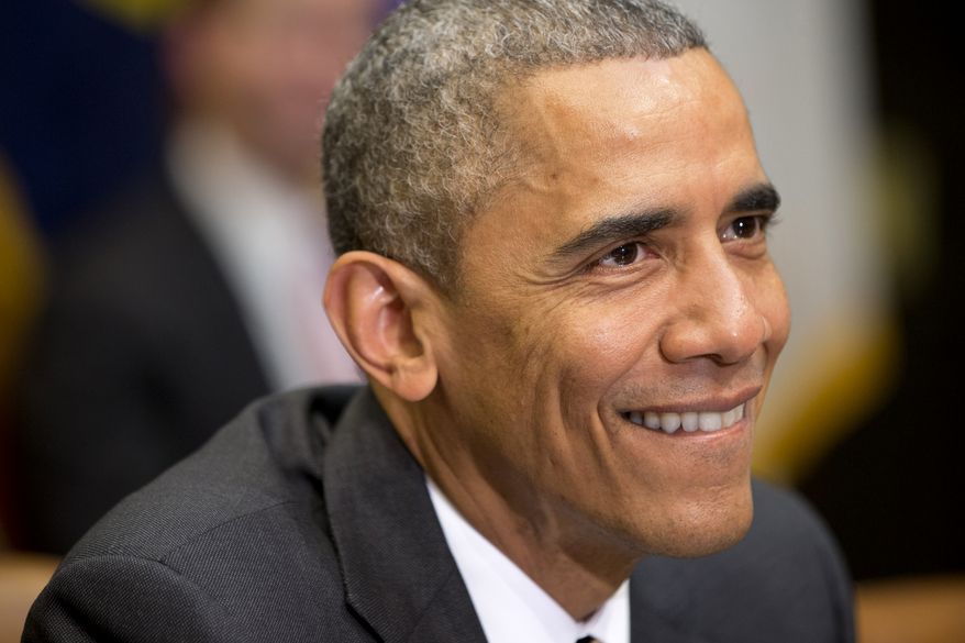 President Barack Obama smiles after being asked by a member of the media about his sore throat, during a meeting with his national security and public health teams about the Ebola response, Friday, Dec. 12, 2014, in the Roosevelt Room of the White House in Washington. (AP Photo/Jacquelyn Martin)