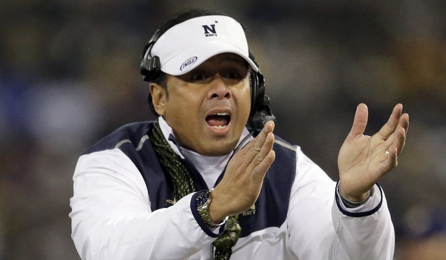 Navy head coach Ken Niumatalolo tries to get an official&#x27;s attention in the second half of the Army-Navy NCAA college football game, Saturday, Dec. 13, 2014, in Baltimore. (AP Photo/Patrick Semansky)