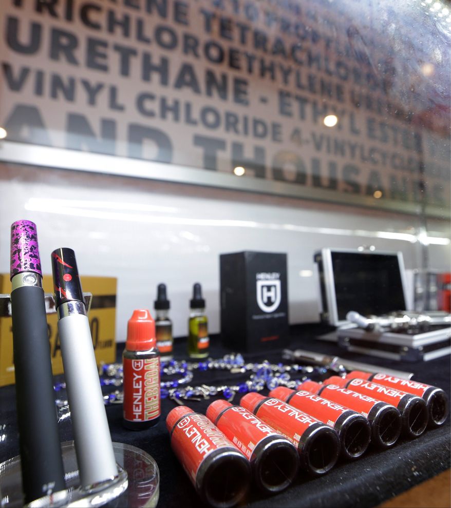 E-cigarettes are usually made of metal parts combined with plastic or glass. They heat the liquid nicotine solution, creating vapor that quickly dissipates when exhaled. A new Montoring the Future survey says teens are flocking to e-cigarettes. (ASSOCIATED PRESS)