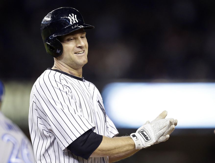 FILE - In this Sept. 18, 2014, file photo, New York Yankees' Chase Headley reacts after driving in the game-winning run during the ninth inning against the Toronto Blue Jays in New York. Headley is staying with the Yankees, giving New York insurance at third base in case Alex Rodriguez is unable to play the field regularly. A person familiar with the negotiations says Headley and the Yankees are working to finalize a $52 million, four-year contract. The person spoke on condition of anonymity Monday, Dec. 15, 2014, because the agreement had not been completed. (AP Photo/Frank Franklin II, File)