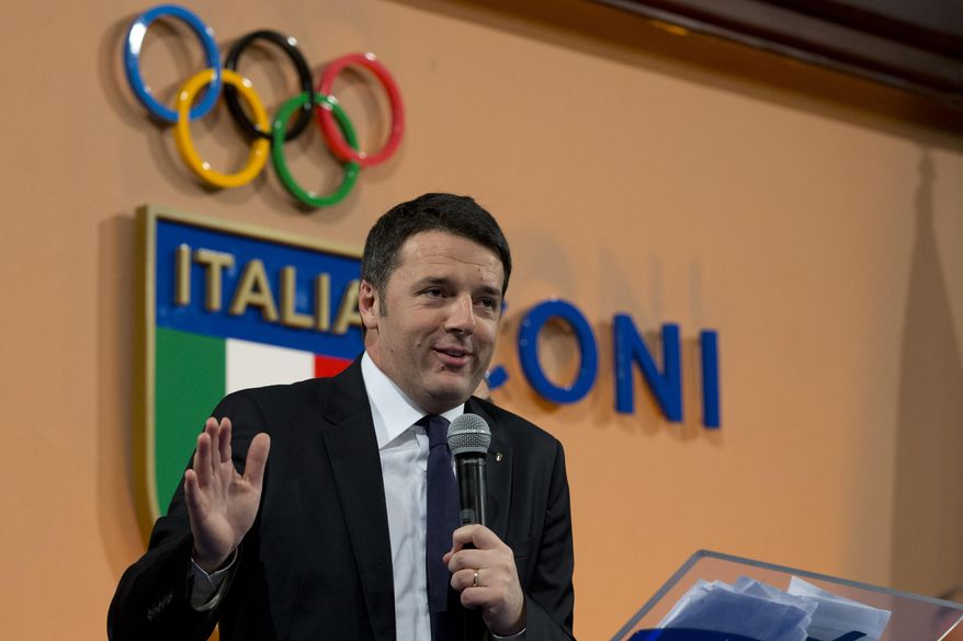 Italian Premier Matteo Renzi delivers his speech at Italian Olympic Committee headquarters in Rome, Monday, Dec. 15, 2014. Renzi says Rome will bid for the 2024 Summer Olympics. He says "the Italian government, together with CONI, is ready for this project." The move comes with Italy's economy still stagnant and amid a widening corruption and mafia scandal in the capital. Italy planned to bid for the 2020 Olympics but the project was scrapped after then-premier Mario Monti refused to provide financial backing. The 2024 host will be chosen in 2017. (AP Photo/Andrew Medichini)