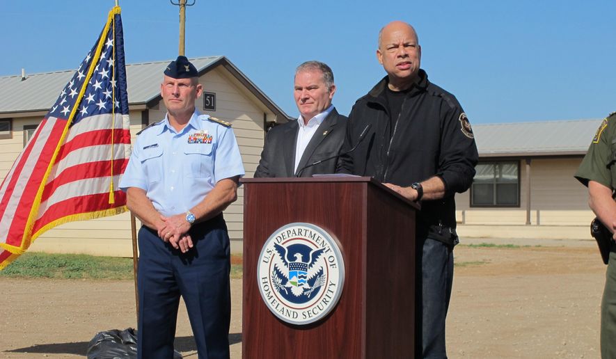U.S. Homeland Security Secretary Jeh Johnson addresses reporters after touring a new family immigration detention center in Dilley, Texas, on Monday, Dec. 15, 2014. Opening following a summer surge of children crossing the U.S.-Mexico border illegally, the compound features cottages and will have an initial capacity of 480 growing to 2,400 around May _making it the nation’s largest family immigration lockup. (AP Photo/Will Weissert)