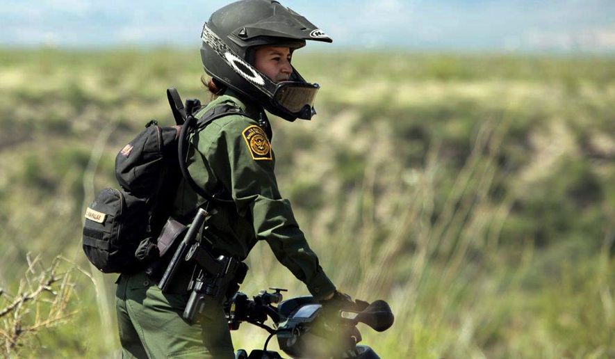 Crystal A. Diaz, a U.S. Border Patrol agent with the Tucson Sector in Arizona, rides her ATV while on patrol.  (AP Photo/U.S. Border Patrol)