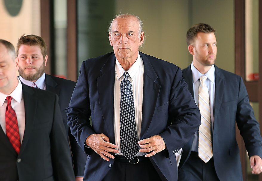 FILE - In this July 8, 2014 file photo former Minnesota Gov. Jesse Ventura, center, leaves federal court in St. Paul, Minn. Ventura, who was awarded $1.8 million in a defamation lawsuit against author Chris Kyle&#x27;s estate, is suing HarperCollins saying publicity about the book and Kyle&#x27;s claims about him generated millions of dollars in profits for the publisher. (AP Photo/The Star Tribune, Elizabeth Flores, File) 
