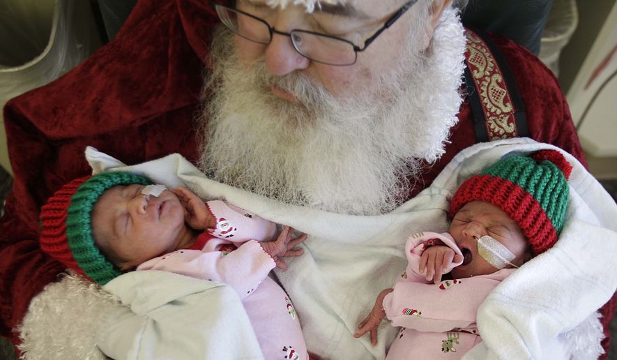 Santa, an industrial engineer who manages the North Pole 364 days a year, is worth an annual salary of $139,924. Moms, who do that and more, only $117,000. (AP Photo)