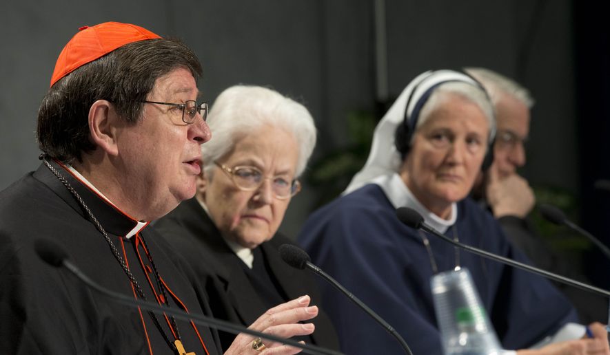 Brazilian Cardinal Joao Braz de Aviz, Prefect of the Congregation for Institutes of Consecrated Life and Societies of Apostolic Life, left, flanked by Sister Sharon Holland, center, and Mother Agnes Mary Donovan, speaks during a press conference at the Vatican, Tuesday, Dec. 16, 2014. The Vatican released the long-awaited results of its controversial three-year investigation into U.S. women's religious orders, and the report was remarkable for what it didn't say. (AP Photo/Andrew Medichini)