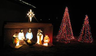 Christmas decorations illuminate the community of Pilger, Neb. (AP Photo/The Norfolk Daily News, LaRayne Topp)