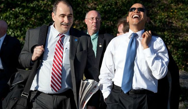 President Barack Obama laughs while walking with Senior Advisor David Axelrod on March 18, 2009. (Official White House Photo by Pete Souza)