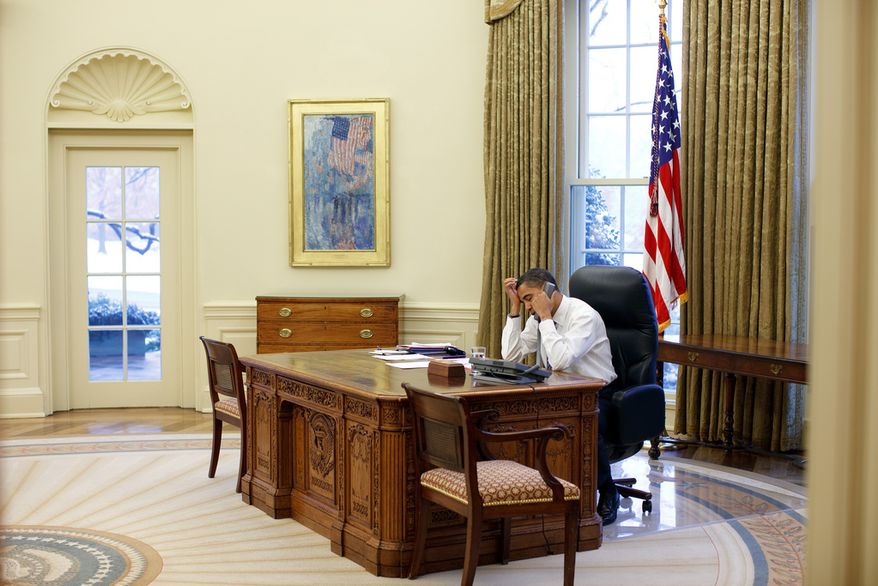 President Barack Obama talks on the phone in the Oval Office, Jan. 28, 2009.
(Official White House Photo by Pete Souza)