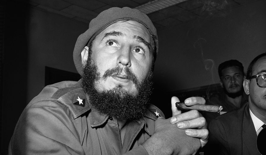 In this June 14, 1961 file photo, Prime Minister Fidel Castro holds a cigar during a news conference in Havana, Cuba. For over half a century, the U.S. government tried many schemes to overthrow the Castro regime: poisonous cigars, an exploding seashell, the secret Twitter-like service in Cuba. U.S. President Barack Obama said Wednesday, Dec. 17, 2014 the United States will re-establish diplomatic ties with Cuba and bring change to the longstanding trade embargo. But it was unclear if all secret operations would cease. (AP Photo/RHS)