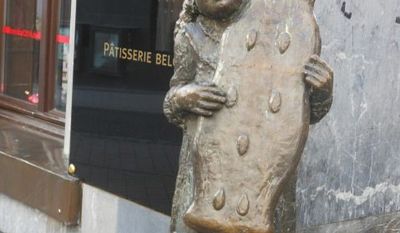 Statue of girl holding Aachen &quot;printen&quot; (spice bread) 
 By Corinna Lothar/Special to the Washington Times