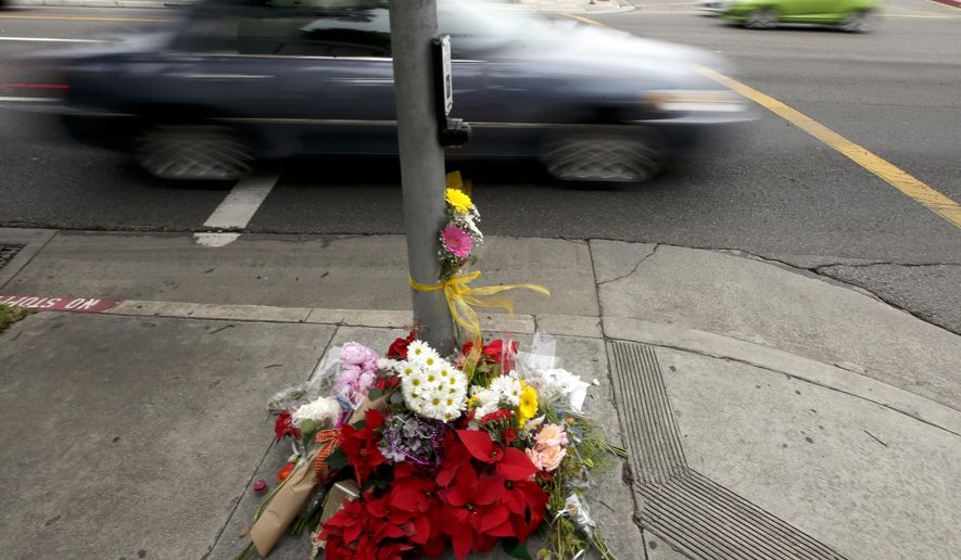 Mourners placed flowers at a makeshift memorial Thursday, Dec. 18, 2014, near where a driver suspected of being intoxicated hit a group of pedestrians and another car outside a church as a Christmas service ended Wednesday night in Redondo Beach, Calif. Three people were killed and several others were injured including five children, police said. Margo Bronstein, 56, was arrested after the crash on suspicion of driving under the influence and vehicular manslaughter, Redondo Beach police Lt. Shawn Freeman said. (Associated Press) **FILE**