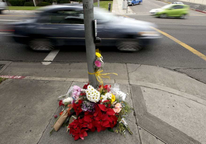 Mourners placed flowers at a makeshift memorial Thursday, Dec. 18, 2014, near where a driver suspected of being intoxicated hit a group of pedestrians and another car outside a church as a Christmas service ended Wednesday night in Redondo Beach, Calif. Three people were killed and several others were injured including five children, police said. Margo Bronstein, 56, was arrested after the crash on suspicion of driving under the influence and vehicular manslaughter, Redondo Beach police Lt. Shawn Freeman said. (Associated Press) **FILE**