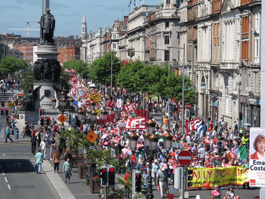 FILE - A Saturday, July 6, 2013 file photo showing thousands of anti-abortion protesters filling Dublin's major thoroughfare, as they march against Ireland's abortion bill. Ireland is debating its constitutional ban on abortion again because of a case involving a brain-dead pregnant woman on life support. Irish media reported Thursday, Dec. 18, 2014, that family members want to turn off the woman’s life support systems but doctors are refusing because the law requires them to defend the right to life of her 16-week-old fetus. Fetuses typically cannot survive outside the womb until around 24 weeks. (AP Photo/Shawn Pogatchnik, File)