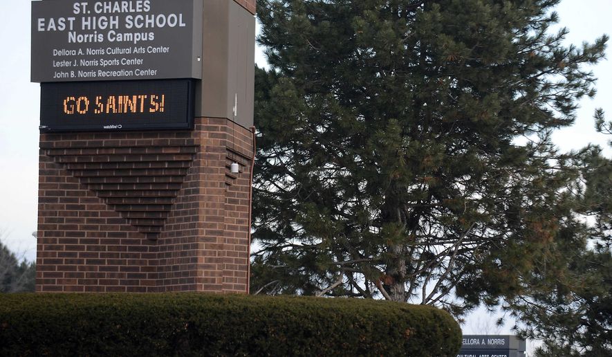 St. Charles East High School in St. Charles, Ill. is shown on Thursday, Dec. 18, 2014. Two St. Charles East High School students have been expelled and face legal ramifications after recently shutting down the district's computer network for the better part of a month. (AP Photo /Daily Herald, Rick West)