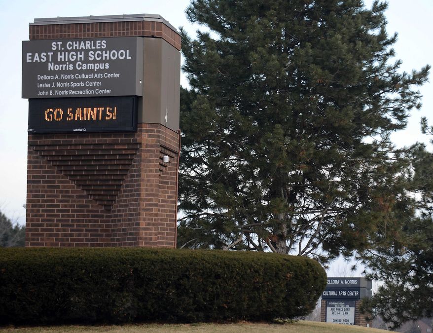 St. Charles East High School in St. Charles, Ill. is shown on Thursday, Dec. 18, 2014. Two St. Charles East High School students have been expelled and face legal ramifications after recently shutting down the district's computer network for the better part of a month. (AP Photo /Daily Herald, Rick West)