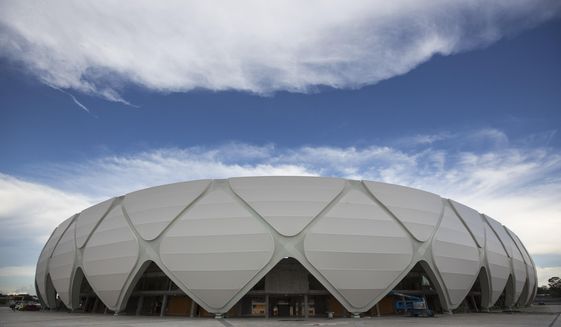FILE - In this May 20, 2014 file photo, Arena da Amazonia stands in Manaus, Brazil. The 44,000-capacity stadium in the jungle city of Manaus, which has no teams in the first, second or third divisions, hosted 11 events since the end of the World Cup in July. Brazil is still trying to find ways to take advantage of some of its new arenas. (AP Photo/Felipe Dana, File)
