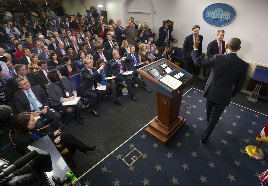 President Barack Obama waves to reporters at the conclusion of his news conference in the Brady Press Briefing Room of the White House in Washington, Friday, Dec. 19, 2014. The president claimed an array of successes in 2014, citing lower unemployment, a rising number of Americans covered by health insurance, and an historic diplomatic opening with Cuba. He also touts his own executive action and a Chinese agreement to combat global warming. (AP Photo/Pablo Martinez Monsivais )