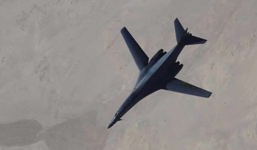 A B-1B Lancer after refueling during U.S.-led airstrikes on ISIS targets in Syria. Military intervention alone won&#39;t avert violent upheaval in the Middle East, says Nasir Shansab. (AP Photo/Staff Sgt. Ciara Wymbs, U.S. Air Force)