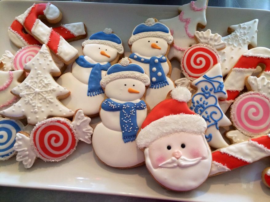 This undated photo shows Christmas cookies made by Sarah Schottler at her business, the Blakeley Street Bakery, in Charles Town, West Virginia. Schottler makes hand-decorated cookies for sale yearround, especially for the holiday season. (AP Photo/Sarah Schottler)