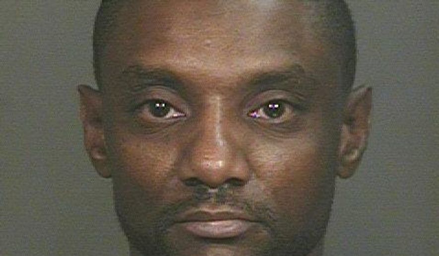 This photo provided by Glendale Police Department, Rickey McGee Brisbon is shown. Brisbon, of Glendale, was arrested Friday, Dec. 19, 2014, on an unrelated charge of domestic violence from a June 2013 case. Authorities say they are investigating a claim that Brisbon physically and sexually assaulted a female. The female victim told authorities that Brisbon also threatened to kill her and Officer Mark Rine. Phoenix police say Rine was investigating a tip that Rumain Brisbon was conducting a drug deal Dec. 2 when he mistook a pill bottle in Brisbon's pocket for a gun and shot him. (AP Photo/Glendale Police Department)