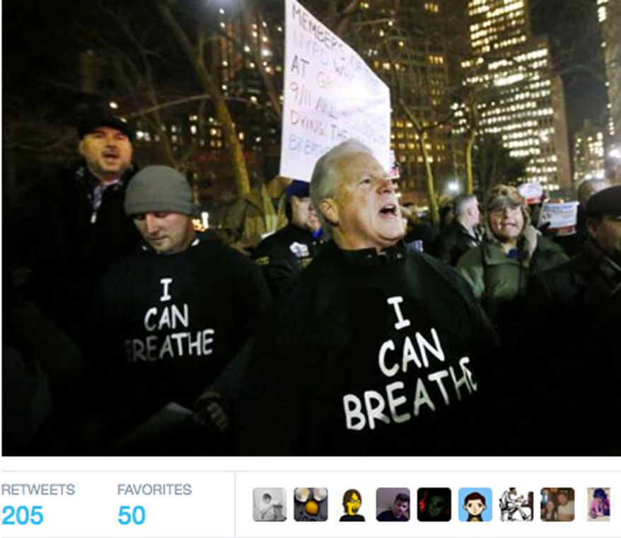 Protesters wear shirts with &quot;I can breathe&quot; on the front and &quot;thanks to the NYPD&quot; on the back during a rally in support of the New York City Police Department, Friday, Dec. 20, 2014. (Image: Twitter, The Independent)