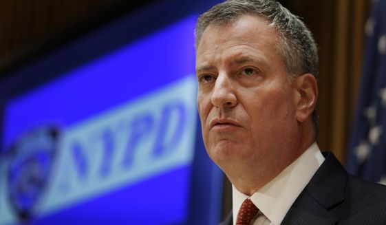 New York City Mayor Bill de Blasio listens during a news conference at police headquarters in New York, Monday, Dec. 22, 2014. (AP Photo/Seth Wenig)