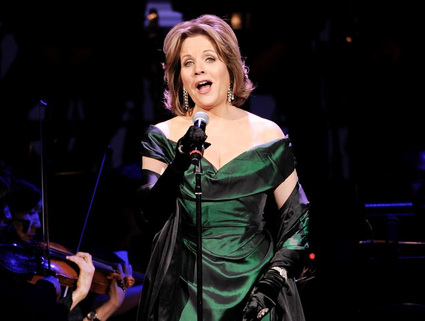 FILE - In this April 17, 2014 file photo, soprano Renee Fleming performs at the 25th Anniversary Rainforest Fund benefit concert at Carnegie Hall in New York. Fleming will make her Broadway debut this spring, playing what else? An opera star. The four-time Grammy Award-winning soprano will star in the comedy “Living on Love” at the Longacre Theatre beginning April 1. (Photo by Evan Agostini/Invision/AP, File)
