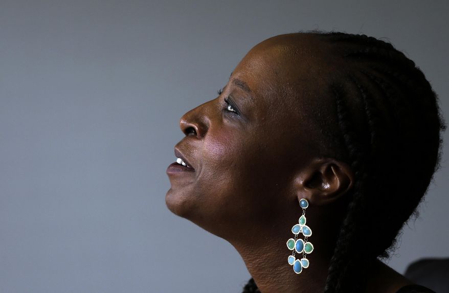 In this photo taken Monday Nov. 24, 2014, author Angela Makholwa speaks during an interview with The Associated Press in Johannesburg, South Africa. Makholwa’s fascination with South Africa’s violent crime has made her one of the country's most popular writers. Using sharply drawn characters and intriguing plots, Makholwa’s fiction helps readers to make sense of the country’s high crime rate. (AP Photo/Themba Hadebe)