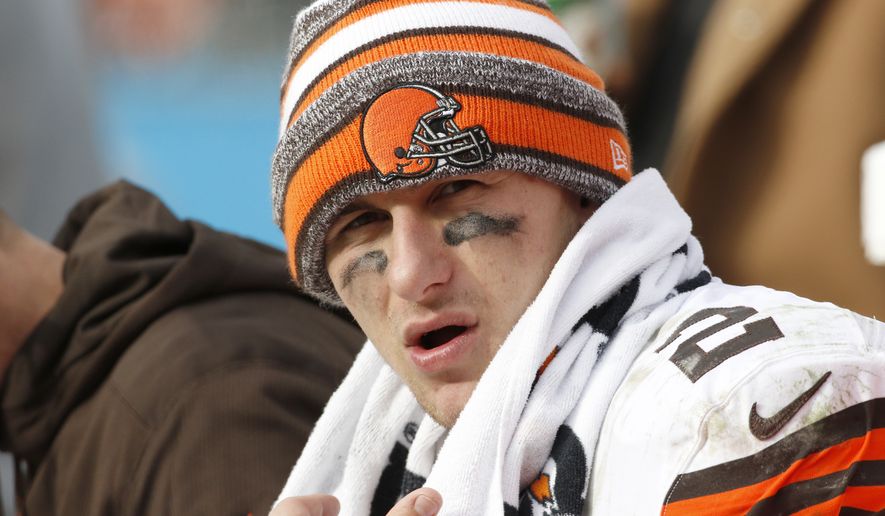 Cleveland Browns&#39; Johnny Manziel (2) on the bench during the second half of an NFL football game against the Carolina Panthers in Charlotte, N.C., Sunday, Dec. 21, 2014. The Panthers won 17-13. (AP Photo/Bob Leverone)