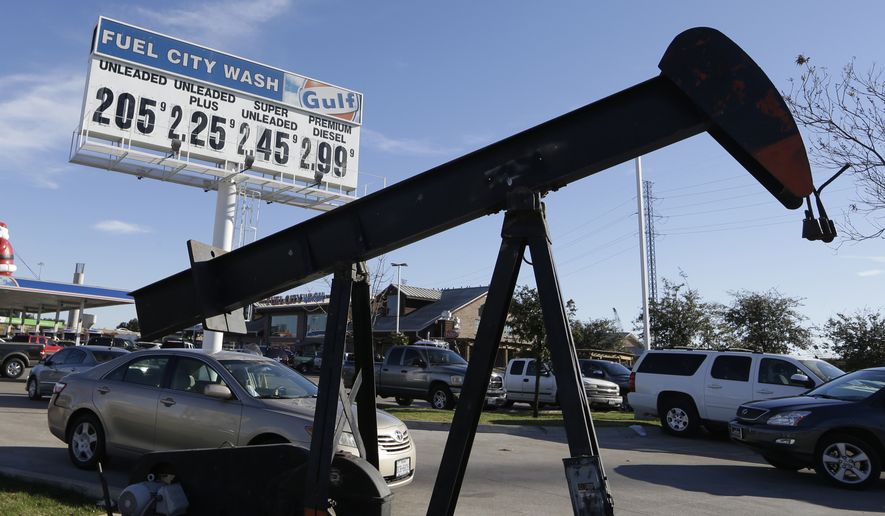 FILE - In this Dec. 15, 2014 file photo, vehicles line up to take advantage of low gas prices at the Fuel City gas station in Dallas. The collapse of oil prices this year has become a huge topic of worry and comfort for investors. (AP Photo/LM Otero, File)