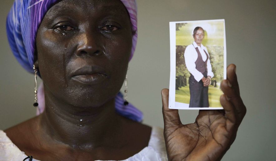Sorrow: Martha Mark is the mother of Monica Mark, one of the schoolgirls kidnapped by Boko Haram. The girls are likely facing forced labor and sexual assault, according to some who managed to escape. (Associated Press)