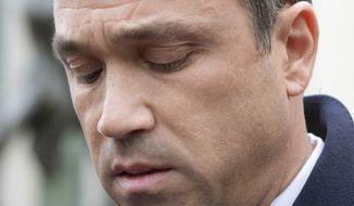 Rep. Michael Grimm speaks to the media outside Federal court in Brooklyn after pleading guilty to a federal tax evasion charge rather than go to trial, Tuesday, Dec. 23, 2014, in New York. Grimm had been set to go to trial in February on charges of evading taxes by hiding more than $1 million in sales and wages while running a Manhattan health-food restaurant. (AP Photo/John Minchillo)