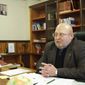 In this Wednesday, Dec. 10, 2014, photo, Sergei Baryshnikov, the new pro-Russian head of Donetsk National University, speaks in his office at the university in Donetsk, eastern Ukraine. Baryshnikov, who stayed behind in Donetsk to head up the rebel-controlled university, said work is now afoot to modify the curriculum in line with the evolving situation. (AP Photo/Balint Szlanko)