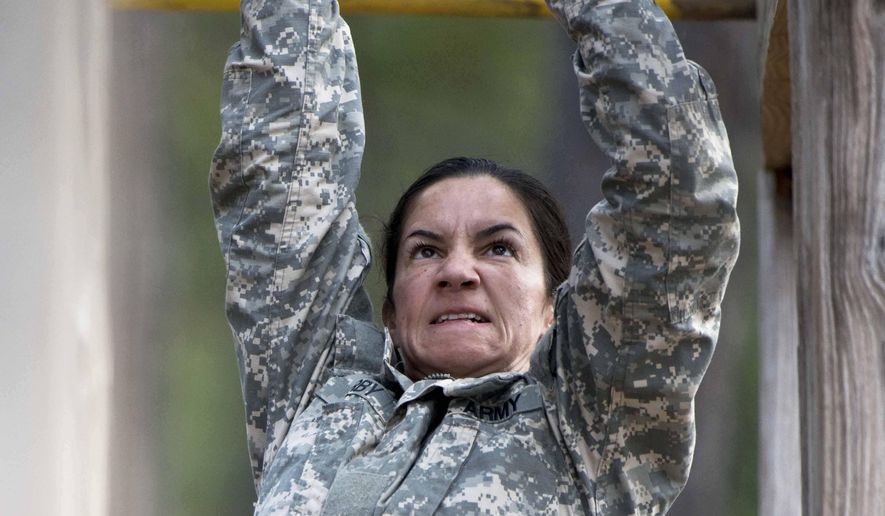 In this undated photo released by the Utah National Guard, 1st. Lt. Alessandra Kirby negotiates the Darby Obstacle Course at Fort Benning during the Ranger Assessment. Kirby, a Utah National Guard soldier will be among a handful of women going to the grueling Army Ranger school as part of the U.S. military&#x27;s first steps toward allowing women to move into the elite combat unit. (AP Photo/US Army, Patrick A. Albright) ** FILE **