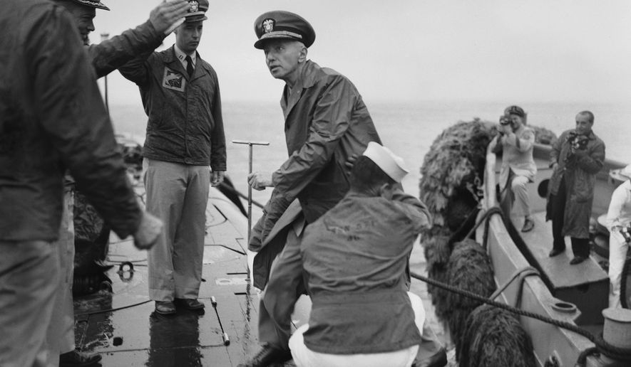 Rear Adm. Hyman G. Rickover, father of nuclear powered submarines, boards the USS Nautilus from the Navy Tug 534 in the Narrows below Brooklyn, New York on August 25, 1958. Cdr. William Anderson, head showing at left, awaits to greet the admiral aboard the U.S. Navy's first nuclear sub. Anderson is skipper of the Nautilus. Saluting at left center is Lt. Donald P. Hall, gunnery officer of the Nautilus. The craft returned earlier from 4-month voyage. (AP Photo/Pool)
