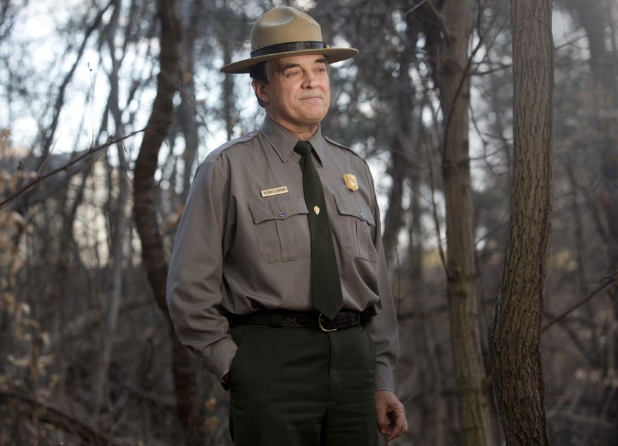ADVANCE FOR SUNDAY DEC 28 Peter Givens is retiring after 25 years with the Blue Ridge Parkway out of the Vinton Ranger Station office. He has spent nearly 40 years with the National Park Service. Givens stands in a portion of the Roanoke Valley trail on Tuesday, Dec. 16, 2014. (AP Photo/The Roanoke Times, Erica Yoon)