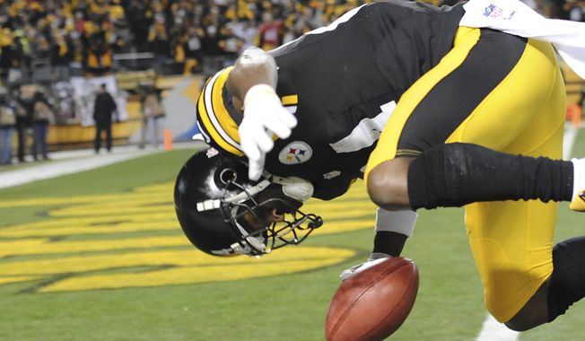 Pittsburgh Steelers wide receiver Antonio Brown (84) flips into the end zone for a touchdown on a punt return during the first quarter an NFL football game against the Cincinnati Bengals, Sunday, Dec. 28, 2014, in Pittsburgh. (AP Photo/Don Wright)