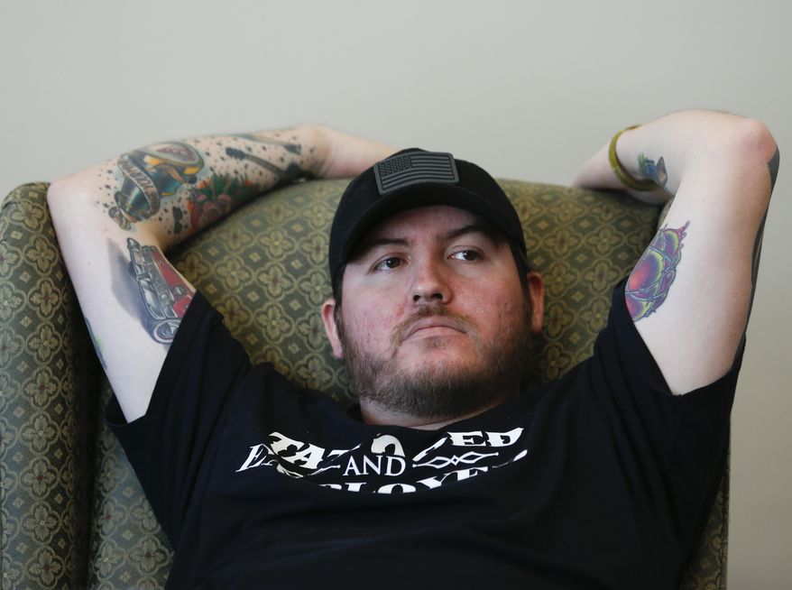 FILE - In this Nov. 15, 2014 file photo, Iraq combat veteran Adan Olid attends a Songwriting With Soldiers retreat in Rensselaerville, N.Y. Olid, who was featured in an Associated Press account of veterans coping with trauma through songwriting, has been found dead. Police said the 29-year-old former marine's body was found Sunday, Dec. 28, 2014 in Guilderland, N.Y. The cause of his death is still under investigation. (AP Photo/Mike Groll, File)