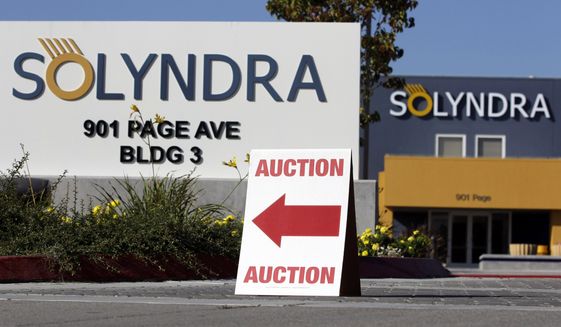 In this Oct. 31, 2011, file photo, an auction sign sits on a curb outside bankrupt Solyndra headquarters in Fremont, Calif. (AP Photo/Paul Sakuma, File)