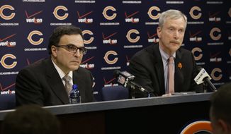 Chicago Bears President and CEO Ted Phillips, left, and Chairman George H. McCaskey listen to question at a news conference at Halas Hall on Monday, Dec. 29, 2014,  in Lake Forest, Ill. Chicago Bears head coach Marc Trestman and general manager Phil Emery were fired Monday after the team completed a disappointing 5-11 campaign.(AP Photo/Nam Y. Huh)