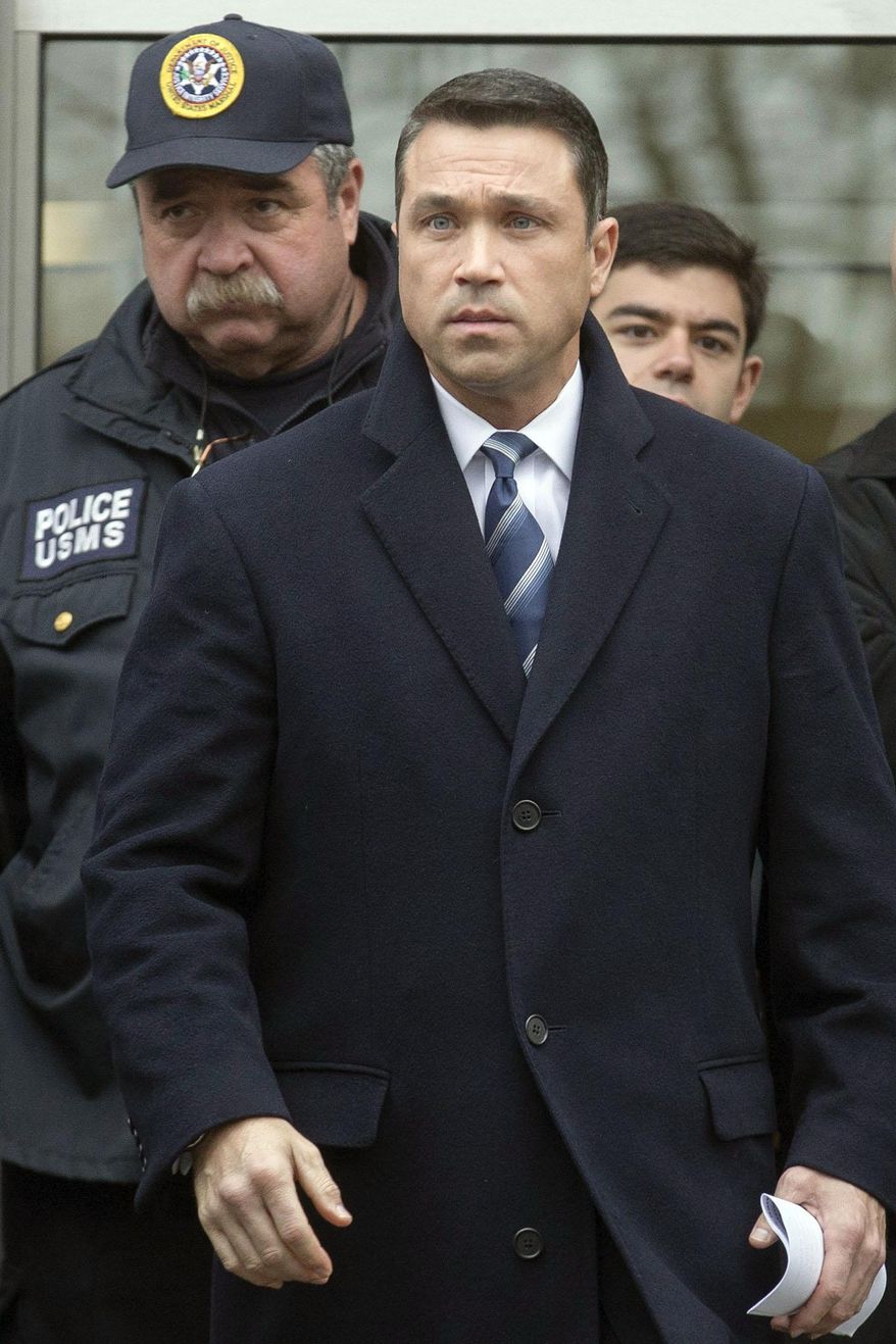 File-This Dec. 23, 2014, file photo shows Rep. Michael Grimm, center, leaving Federal court in Brooklyn after pleading guilty to a federal tax evasion charge rather than go to trial in New York. A Republican source says the New York congressman is expected to resign before Congress returns to Washington next week. Following his conviction, Republican Congressman Michael Grimm had said he would stay in Congress as long as he could. But Grimm reportedly talked with House Speaker John Boehner Monday, Dec. 29, 2014, and will instead step down. (AP Photo/John Minchillo, File)