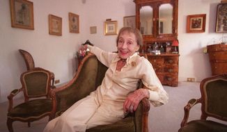 Actress Luise Rainer poses in her central London apartment in this July 29, 1999, file photo. Rainer, a star of cinema&#39;s golden era who won back-to-back Oscars but then walked away from a glittering Hollywood career, has died. She was 104. (AP Photo/Adam Butler, File)