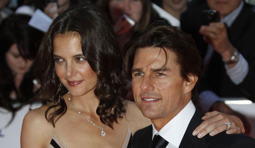In this Wednesday, May 26, 2010 file photo US actor Tom Cruise, right, poses with his wife US actress Katie Holmes for the photographers as they arrive for the National Movie Awards at the Royal Festival Hall, in London. Holmes' attorney Jonathan Wolfe said Friday June 29, 2012 that the couple is divorcing, but called it a private matter for the family. ( AP Photo/Lefteris Pitarakis)